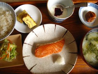 Japanese breakfast display of salmon, miso soup umeboshi