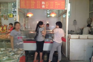 Customers at a cold dish stall in Beijing. Credit: Manuela Zoninsein