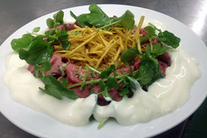 Fresh Ibérico pork with Manchego and saffron. Credit: Courtesy of Spain's Monastrell restaurant