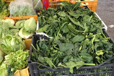 Baskets of greens for sale at a market in Camucia, Italy. Credit: Nancy Harmon Jenkins