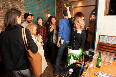 Dramatically pouring Asturian sidra natural into a glass, the traditional way. Credit: Greg Nesbit / Asturias Cider Commission