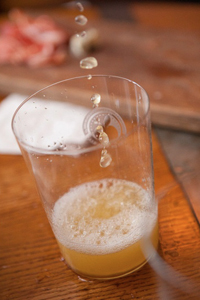 Asturian sidra natural being poured into a glass. Credit: Greg Nesbit / Asturias Cider Commission