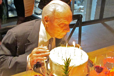 Peter Mondavi Sr. blows out the candles on his birthday cake at a party celebrating his 99th birthday. Credit: Mira Honeycutt