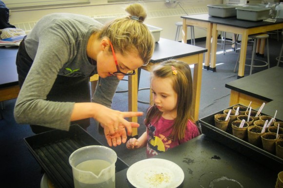 Fighting Hunger: Ashley Dress helps Addison Neville, a preschooler at Iowa's St. Joseph Community School, plant pepper seeds. Credit: Teresa Knutson Fighting Hunger: Ashley Dress helps Addison Neville, a preschooler at Iowa's St. Joseph Community School, plant pepper seeds. Credit: Teresa Knutson
