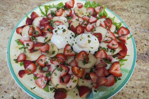 A peach salad with strawberries, burrata, Thai basil and mint. Credit: Brooke Jackson