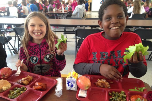 Della Davidson Elementary School students enjoy lettuce for lunch from their school garden plots Credit: Sunny Young Della Davidson Elementary School students enjoy lettuce for lunch from their school garden plots Credit: Sunny Young