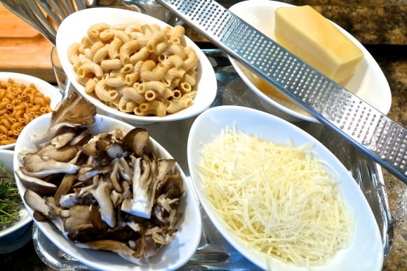 In the kitchen at The Peninsula Beverly Hills are some of the ingredients used by chef David Codney and his team to prepare truffle macaroni and cheese, including hen-of-the-woods or maitake mushrooms, grated Parmigiano-Reggiano cheese, sweet butter, whole wheat ridged macaroni and thyme sprigs. Credit: David Latt