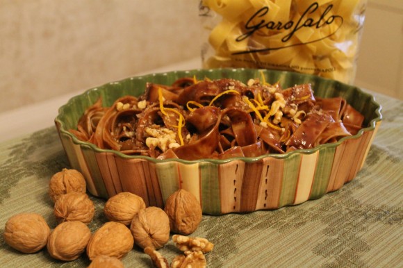 A mound of luscious pasta is tossed in a sweet dark chocolate sauce and topped with grated chocolate and walnuts. Credit: Garofalo Pasta Company