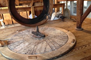 Bottom stone and wooden casing at the Plimoth Grist Mill, which runs on water. Credit: Amy Halloran