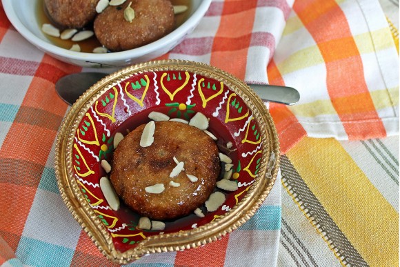 Pithey, a sweet dumpling made with ingredients symbolic of the rural bounty -- rice, coconuts and date palm jaggery -- is part of the celebration of the beginning of the harvest season known as Makara Sankranti in India. Credit: Rinku Bhattacharya