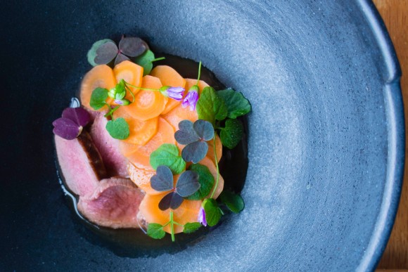 Faroese Lamb Fillet With Fermented Carrots, Wild Herbs and Lamb Bouillon. Credit: Carla Capalbo