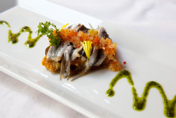 Otramanera's fresh sardine fillets dressed in a fruity papaya salsa augmented with a cilantro purée and crowned with edible flowers. Credit: Copyright Nicolas Gilman