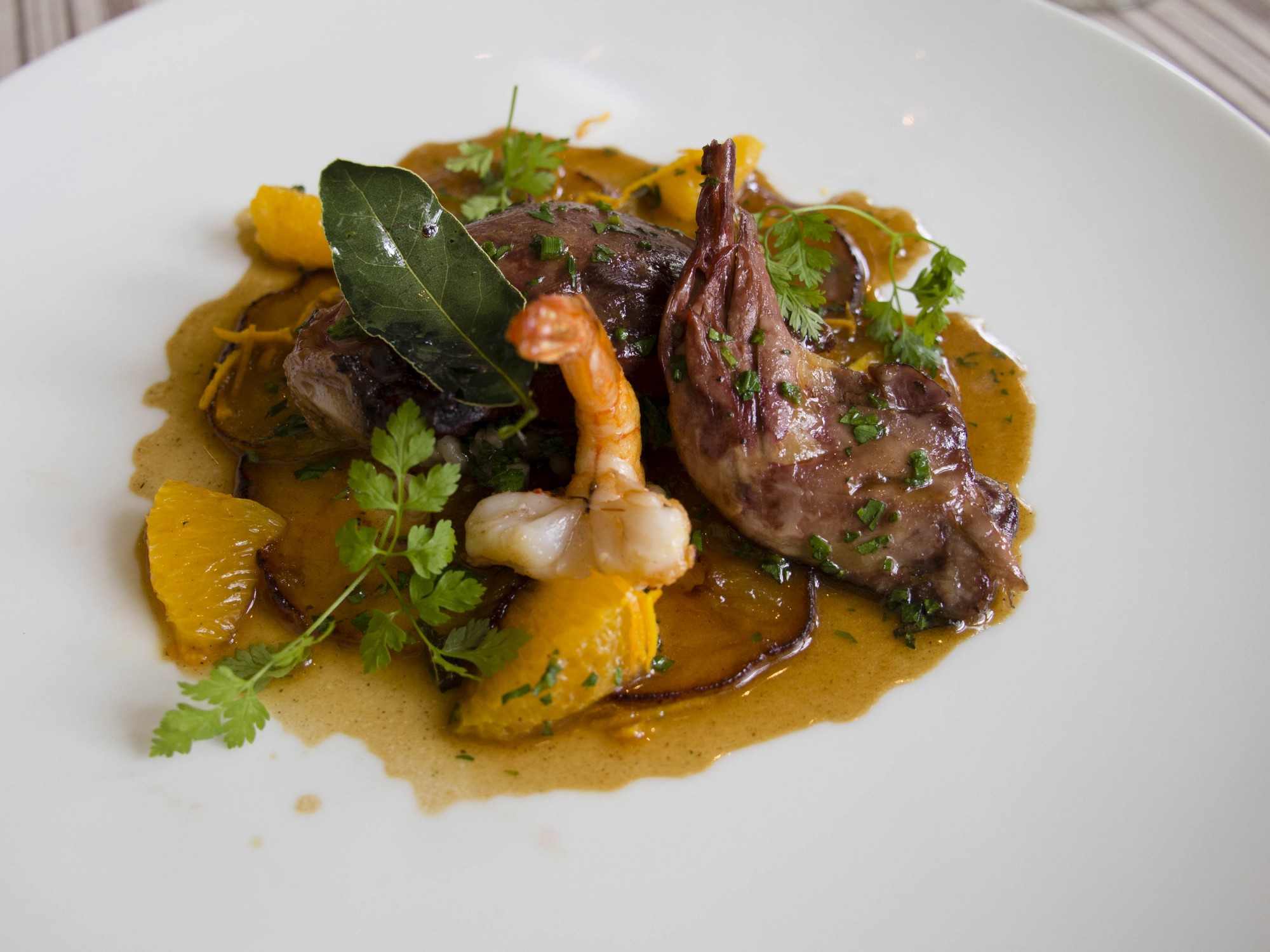 Pigeon is cooked with shrimp, bay leaf and tangerine. Credit: Copyright 2015 Carla Capalbo