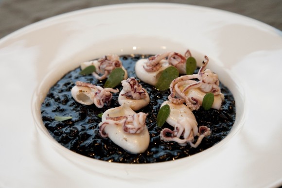At Venissa restaurant in Venice, fresh squid is served on a bed of black risotto. Credit: Copyright 2013 Carla Capalbo