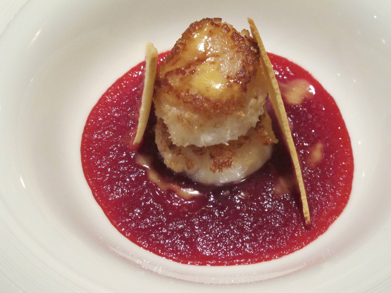 A contemporary capesante adds passion fruit and a delicate beetroot cream. Credit: Copyright 2014 Cesare Zucca