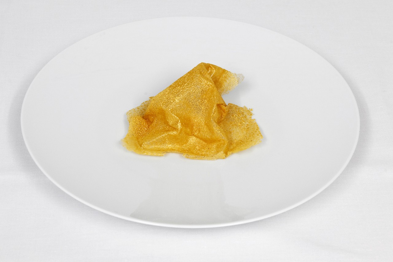 Bread is Gold, the chef says, is a dessert that's an ode to a dish of stale bread dipped in warm, sweetened milk. It is also a nod to the artist Sylvie Fleury's gold-plated trash cans. Credit: Copyright "Never Trust a Skinny Italian Chef," by Massimo Bottura 