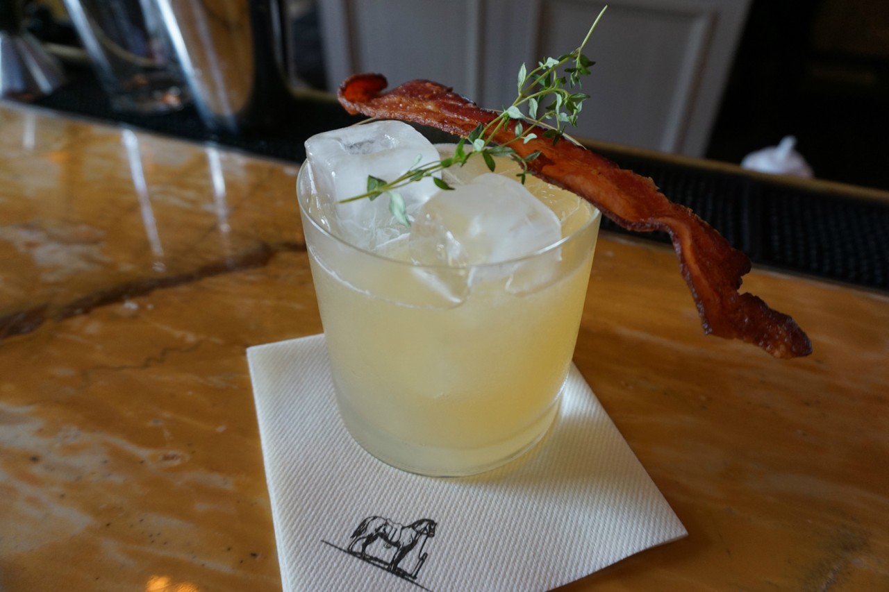 The Thyme Me is a fun alternative to a Bloody Mary, featuring classic breakfast flavors like maple syrup and bacon. Keep the garnish in place as you sip, so you get the aromatics from the bacon. Then, when you've finished your drink, it's snack time. Credit: Copyright 2015 Oscar E. Murden Jr. 