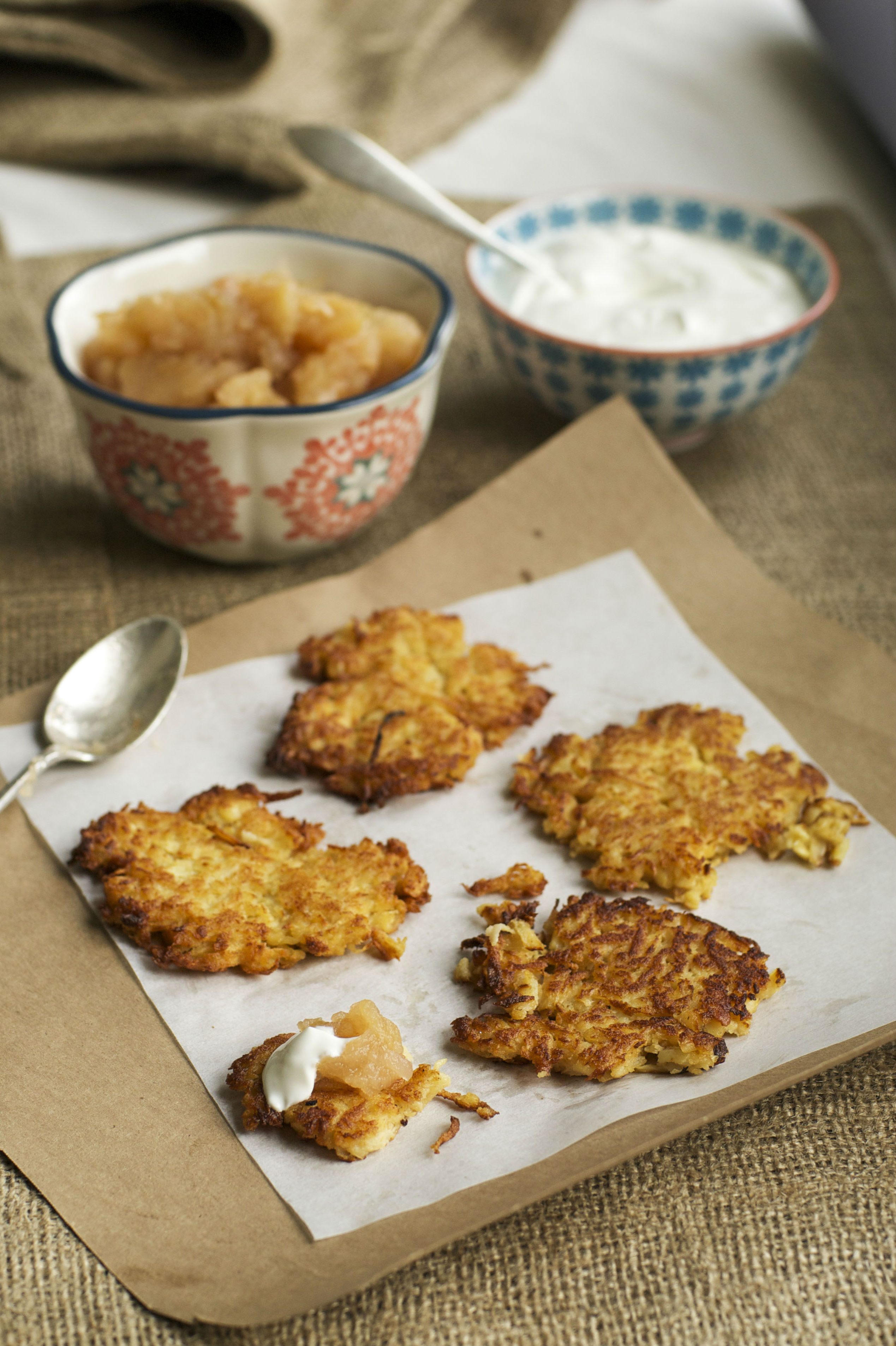 The author's family makes latkes that are thin, crisp and made from grated potatoes. Credit: Copyright 2015 Staci Valentine; reprinted with permission from "The Seasonal Jewish Kitchen"