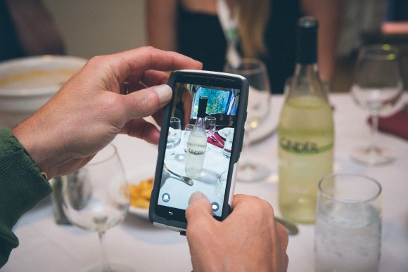 A wine lover snaps a photo of a Cinder wine, one of Idaho's new offerings. Credit: Copyright 2015 Matt Green