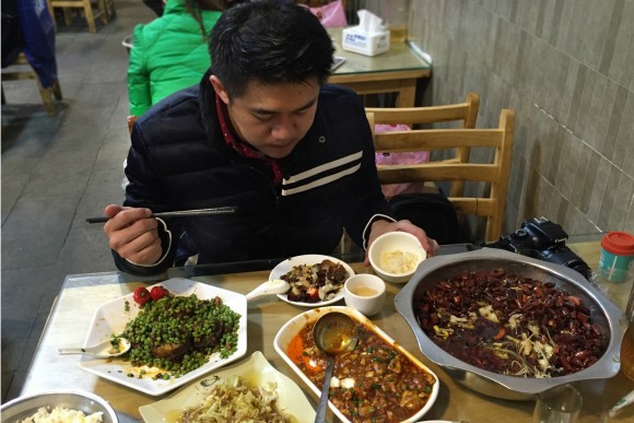Mexican chef Luís Chiu tries a bevy of dishes during his culinary tour of Chengdu. Credit: Copyright 2016 Nicholas Gillman