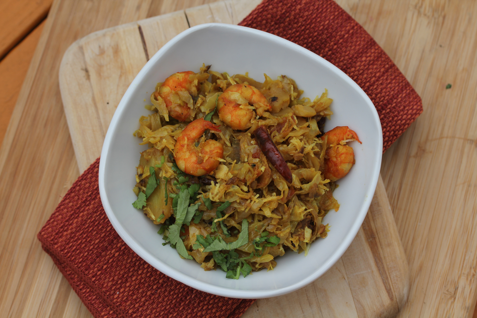 Chingri Badha Kopir Ghanto (Curried Cabbage With Potatoes and Shrimp). Credit: Copyright 2016 Rinku Bhattacharya