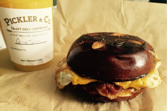 Pickler & Co in Midtown East celebrates the deli bacon, egg and cheese with cage-free eggs, Applegate bacon and cheddar all pressed on a buttered pretzel roll. Credit: Copyright 2016 Nicole Litvack