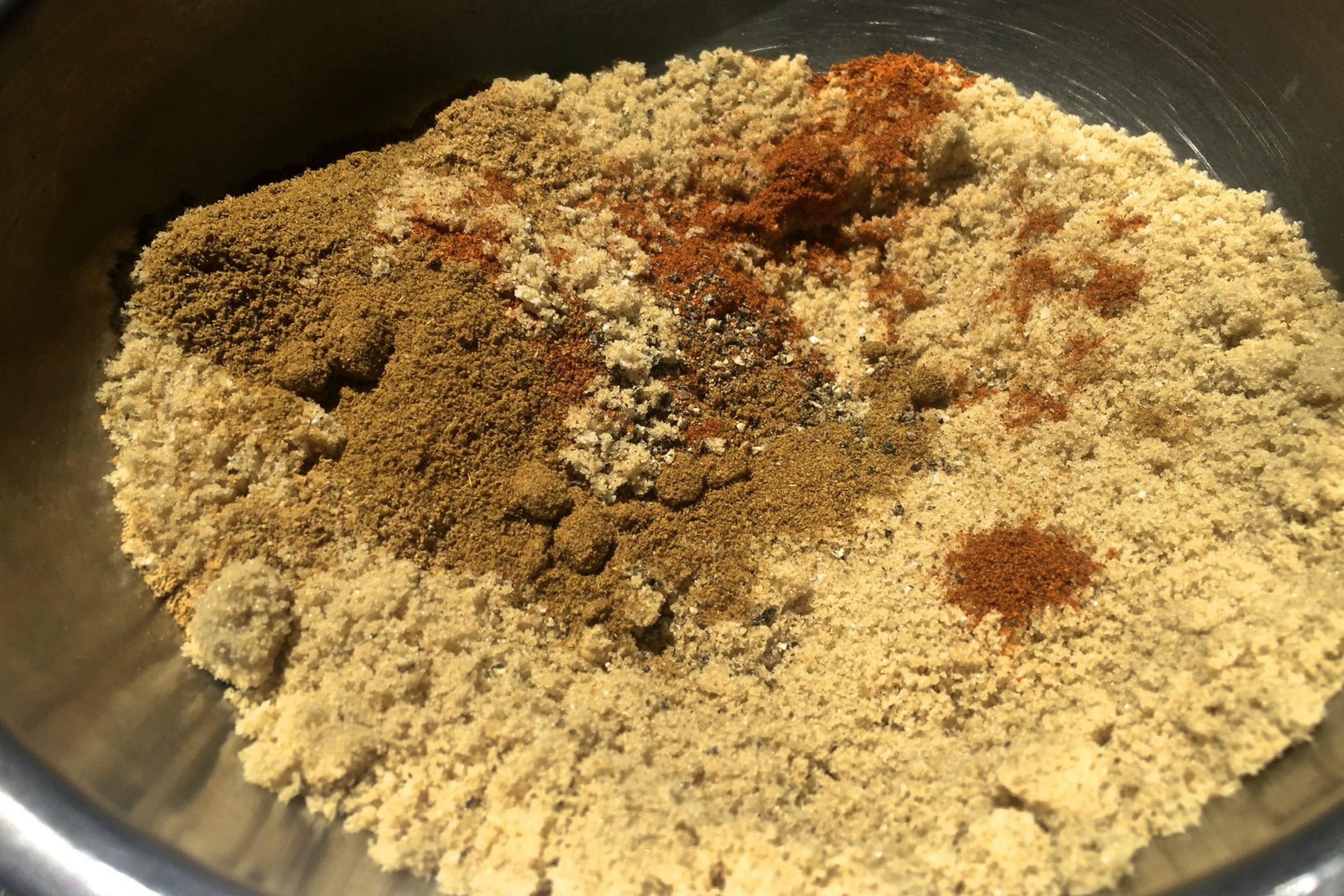 Mix of kosher salt, black pepper, brown sugar, cumin, coriander and cayenne for dry rub slow roasted pork ribs. Credit: Copyright 2016 David Latt