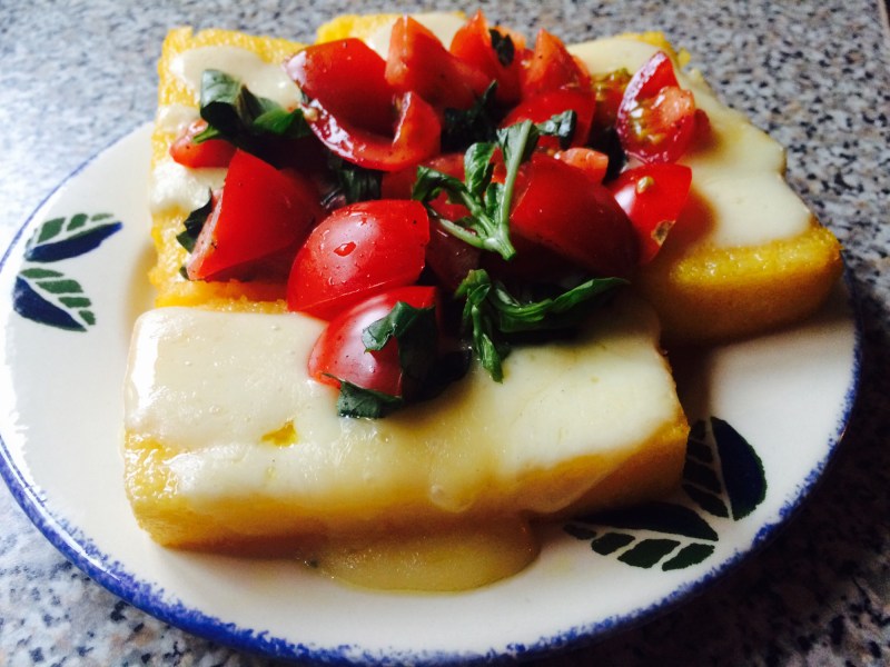 Grilled Polenta With Fontina and diced tomatoes can be made in about 30 minutes, if you use instant polenta. Credit: Clarissa Hyman