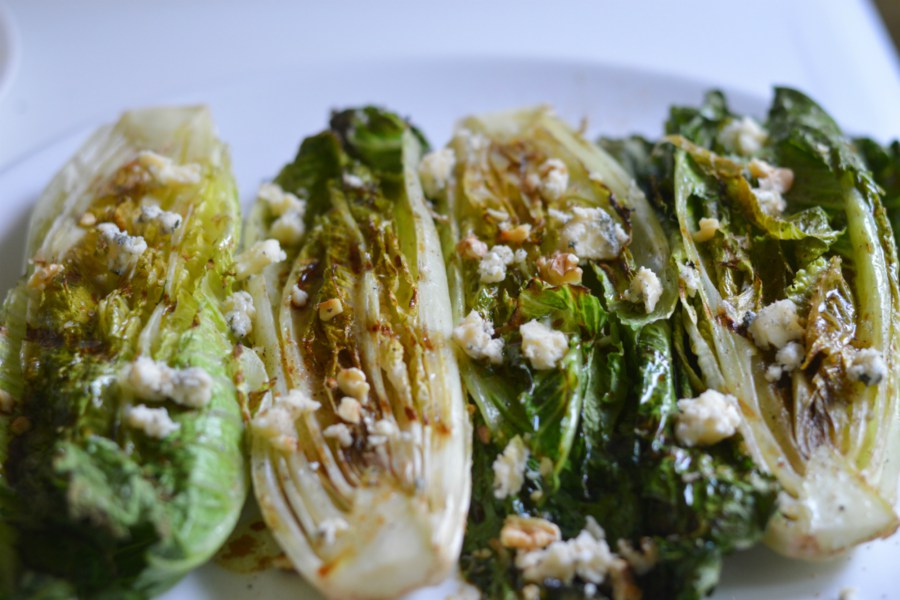 Drizzle grilled romaine lettuce with balsamic vinaigrette and top with crumbled blue cheese, toasted walnuts and fresh ground pepper. Credit: Copyright 2015 Tina Caputo